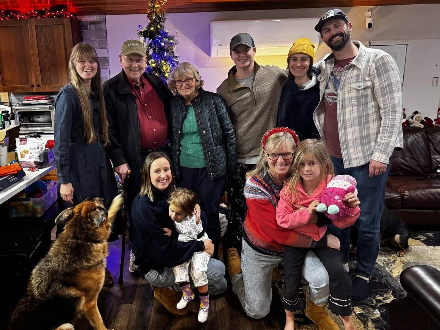 Robin's family gathered around the Christmas tree